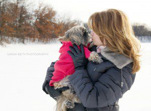 shih tau with woman in snow