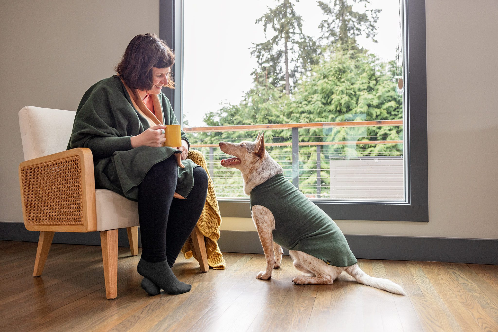 cozy in home woman and dog in matching fleece
